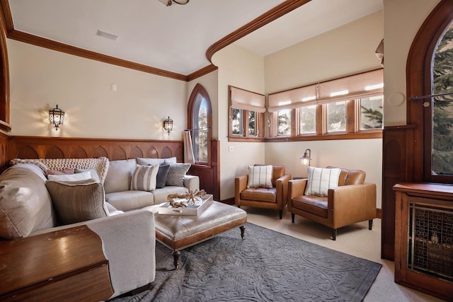 carpeted living room with ornamental molding