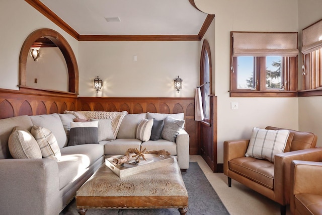 carpeted living room featuring crown molding