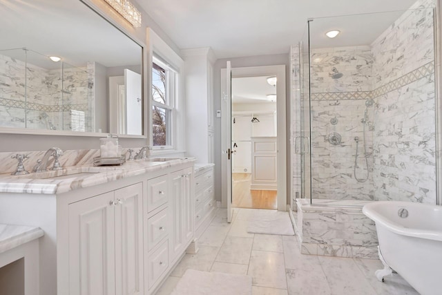 bathroom featuring separate shower and tub and vanity