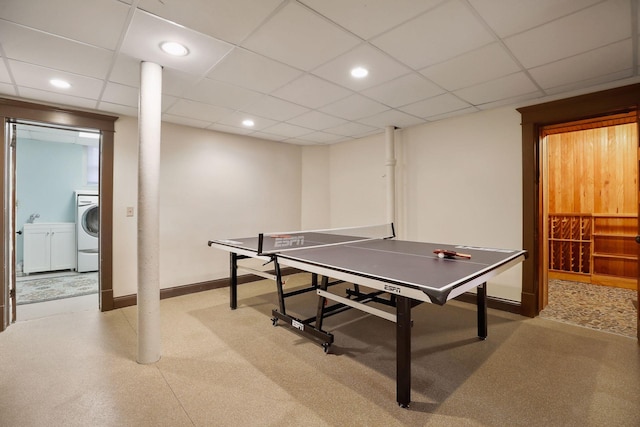 recreation room with washer / dryer and a paneled ceiling