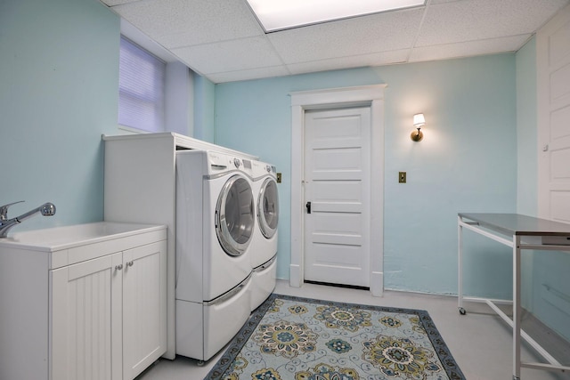 clothes washing area featuring washer and dryer and sink