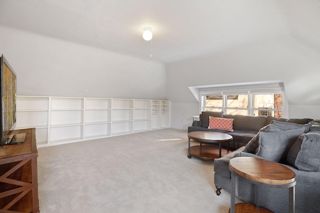 living room with vaulted ceiling and carpet floors