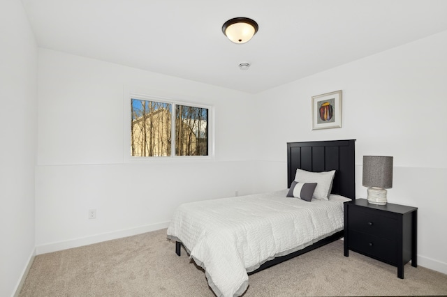 bedroom featuring light carpet