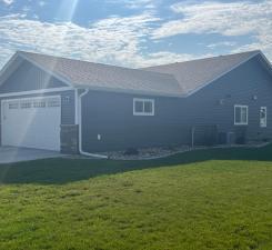 view of front of home featuring a front yard and a garage