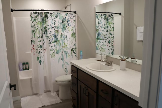 full bathroom featuring toilet, vanity, shower / tub combo with curtain, and wood-type flooring