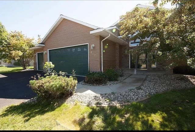 view of side of home with a garage