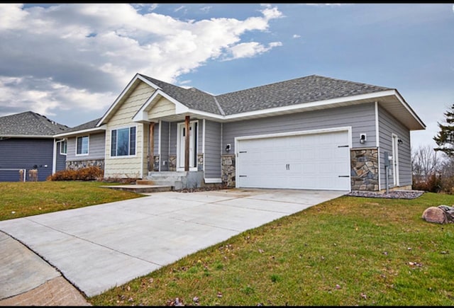 view of front facade with a garage and a front lawn