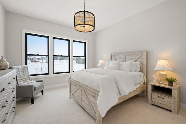 bedroom with light colored carpet