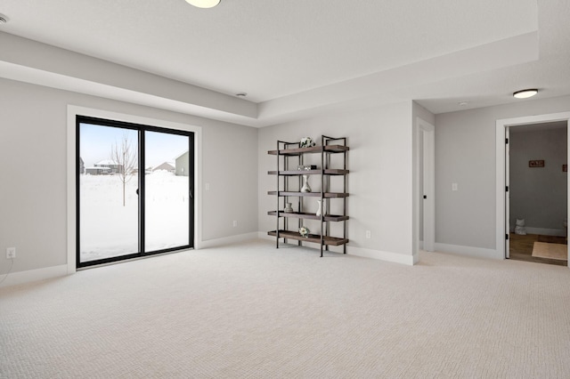 unfurnished room featuring light colored carpet