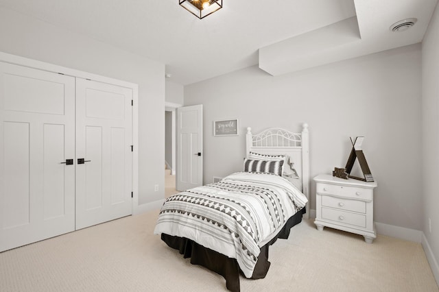 carpeted bedroom with a closet