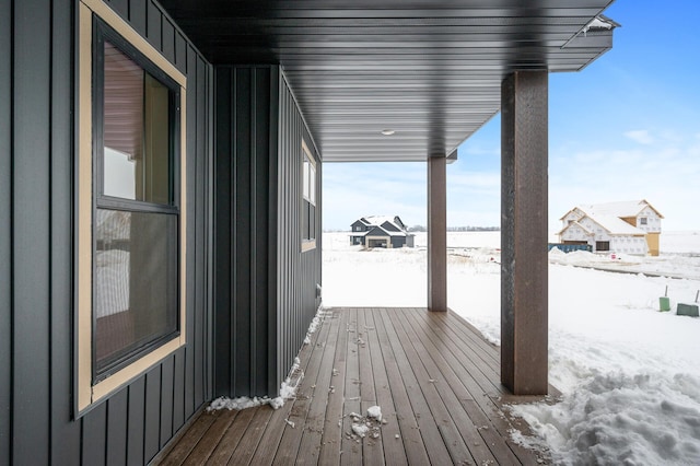 view of snow covered deck