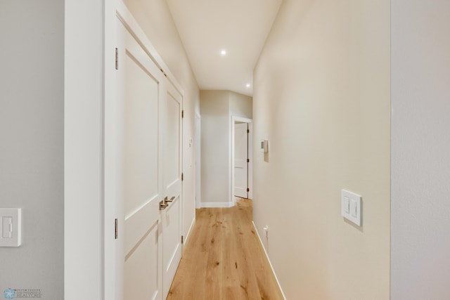 hall with light hardwood / wood-style flooring