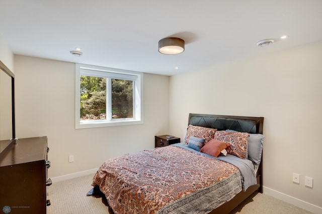 bedroom with light colored carpet