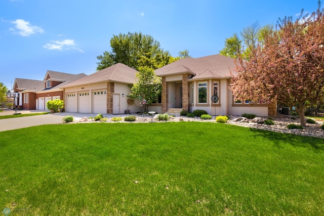 view of front of home featuring a garage and a front lawn