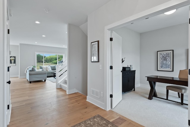 hall with light hardwood / wood-style floors