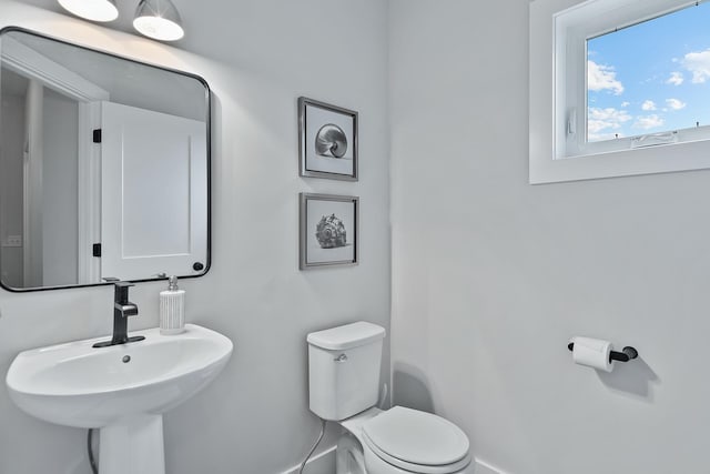 bathroom with toilet and sink