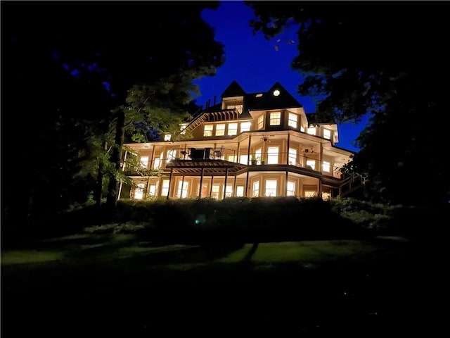 view of back house at twilight