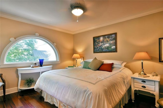 bedroom with ornamental molding and dark hardwood / wood-style floors