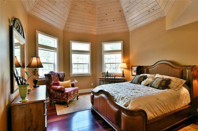 bedroom featuring dark hardwood / wood-style floors, high vaulted ceiling, and wood ceiling