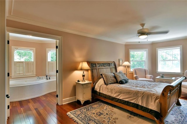 bedroom featuring dark hardwood / wood-style flooring, ceiling fan, ornamental molding, and multiple windows