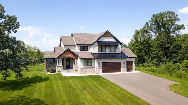 craftsman-style house featuring a front lawn and a garage