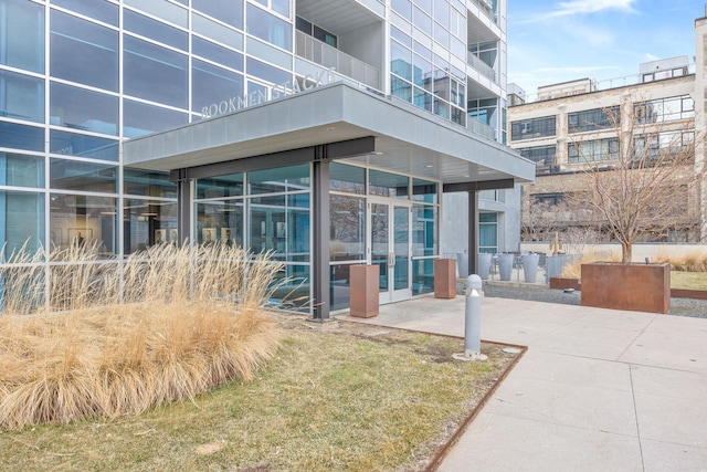 property entrance featuring a patio and a balcony