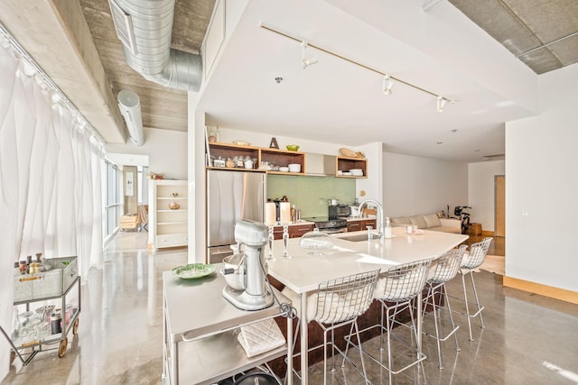 dining area with sink and concrete flooring