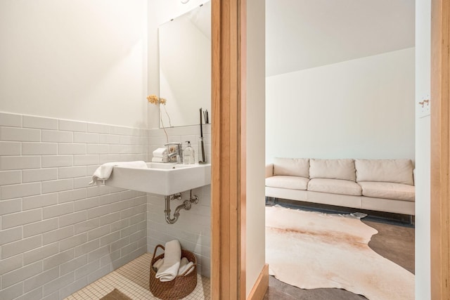 bathroom featuring tile walls, sink, and tile patterned floors