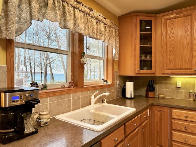 kitchen featuring decorative backsplash and sink