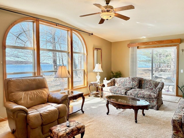 living room with light colored carpet and ceiling fan