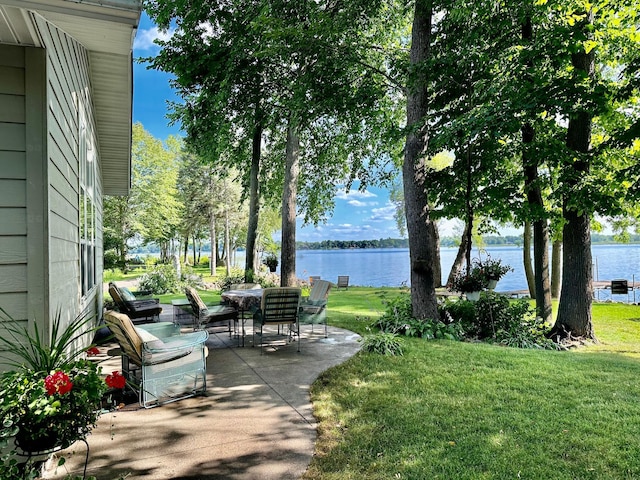 view of patio with a water view