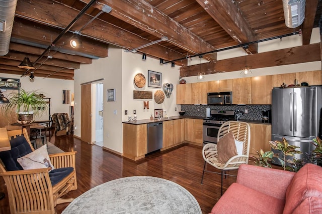 kitchen featuring wood ceiling, appliances with stainless steel finishes, beamed ceiling, backsplash, and dark wood-type flooring