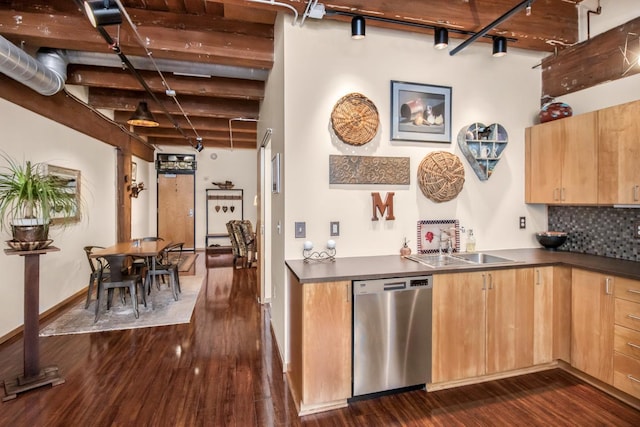 kitchen featuring beam ceiling, stainless steel dishwasher, dark wood-type flooring, and tasteful backsplash