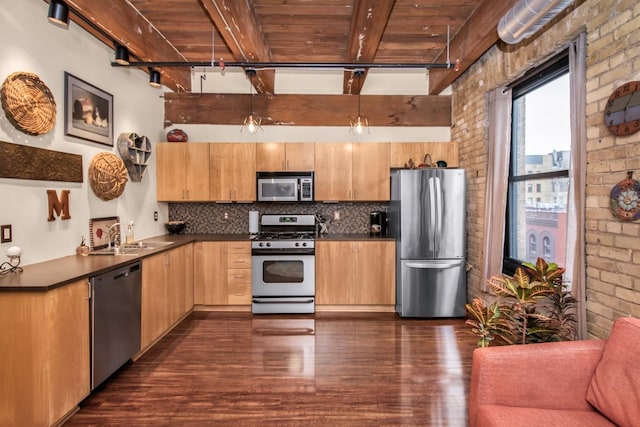 kitchen featuring beamed ceiling, dark wood-type flooring, stainless steel appliances, brick wall, and wooden ceiling