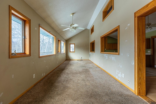 empty room featuring a textured ceiling, ceiling fan, carpet flooring, and baseboards