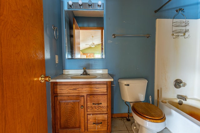 full bathroom featuring toilet, vanity, baseboards,  shower combination, and tile patterned floors