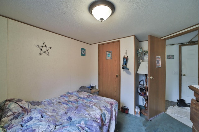 carpeted bedroom with a textured ceiling