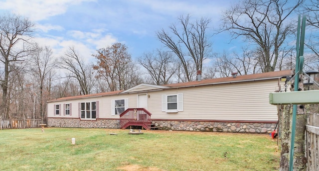 view of front of property with fence and a front yard