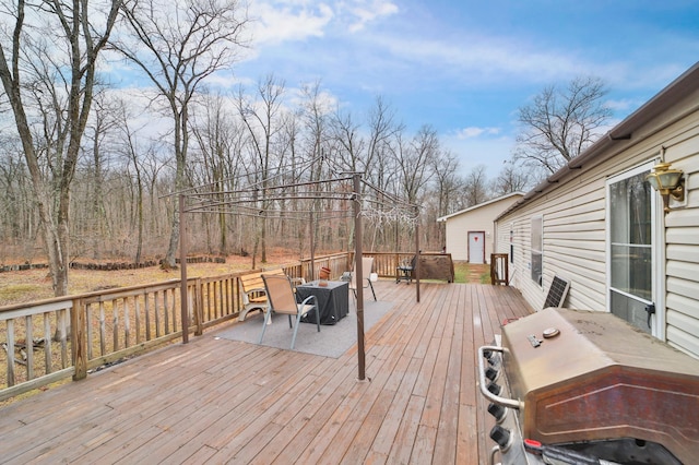 wooden terrace featuring area for grilling