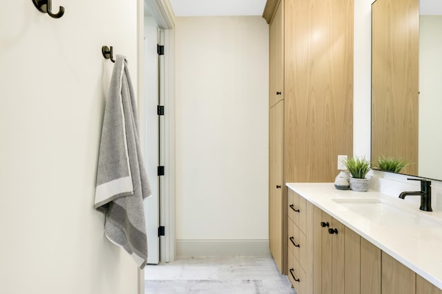 bathroom featuring wood-type flooring and vanity