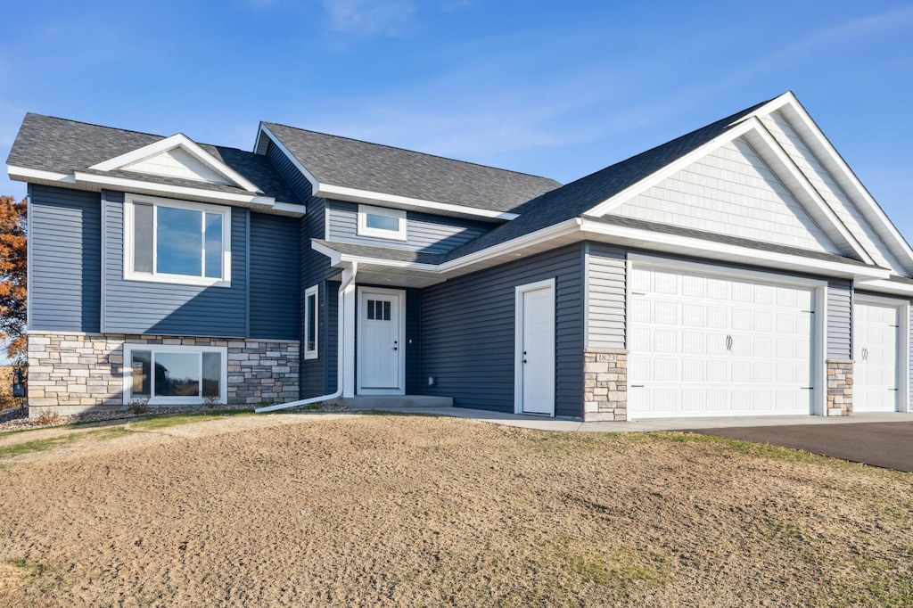 view of front facade with a front lawn and a garage