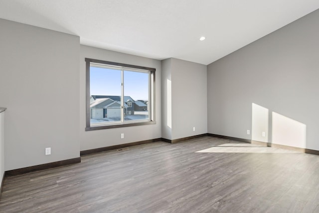 unfurnished room featuring wood-type flooring