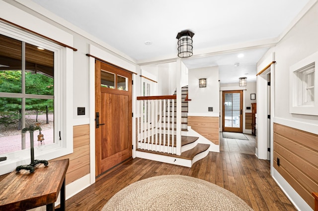 entryway with dark hardwood / wood-style floors