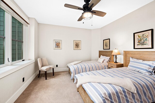 bedroom featuring ceiling fan and carpet floors