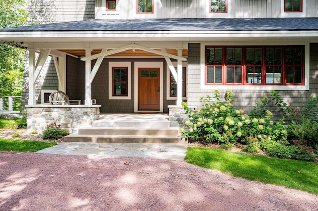 doorway to property featuring a porch