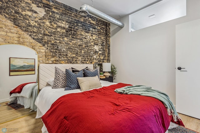 bedroom featuring hardwood / wood-style floors