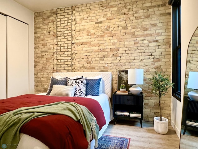 bedroom with light wood-type flooring