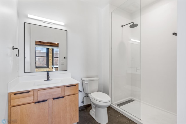 bathroom with tile patterned floors, vanity, toilet, and an enclosed shower