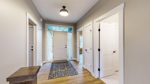 foyer entrance with light hardwood / wood-style floors