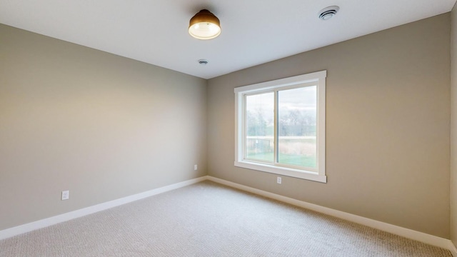 unfurnished room with carpet